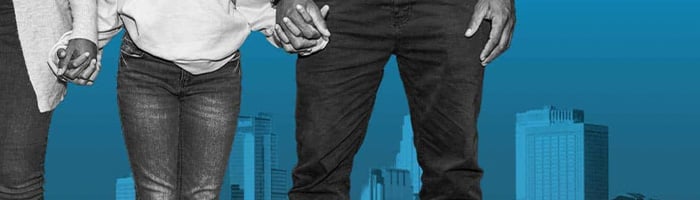 People holding hands. On blue background of city.